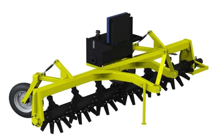 Rock rake clearing agricultural field surface stones